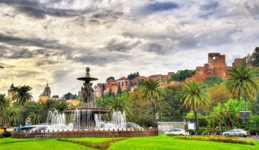 Tres Gracias Fountain and Alcazaba Castle in Malaga